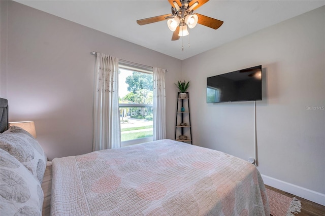 2601 Upton St S, Gulfport, FL 33711 - bedroom featuring baseboards, wood finished floors, and ceiling fan