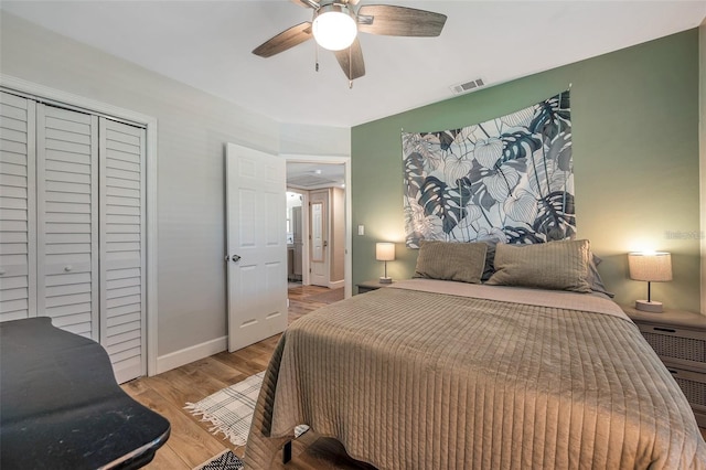2601 Upton St S, Gulfport, FL 33711 - bedroom with wood finished floors, a closet, ceiling fan, and baseboards
