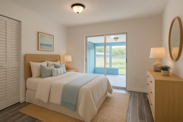 4546 Ontario Dr, New Port Richey, FL 34652 - bedroom featuring access to exterior, dark wood finished floors, and baseboards