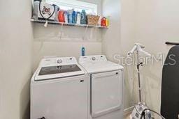 laundry room featuring washer and clothes dryer