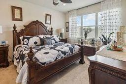 bedroom featuring light carpet and ceiling fan