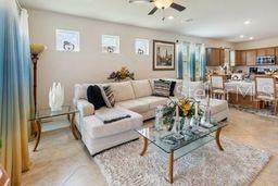 living room with ceiling fan and recessed lighting