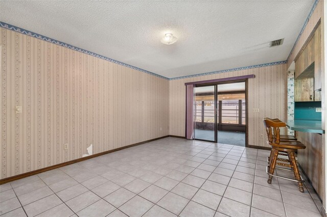 4307 Oak Ct, Saint Cloud, FL 34769 - empty room featuring a textured ceiling and baseboards