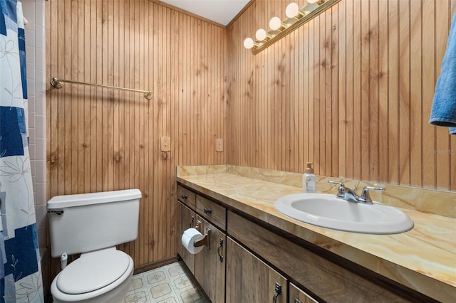 4307 Oak Ct, Saint Cloud, FL 34769 - bathroom featuring vanity, toilet, wood walls, tile patterned floors, and a shower with shower curtain
