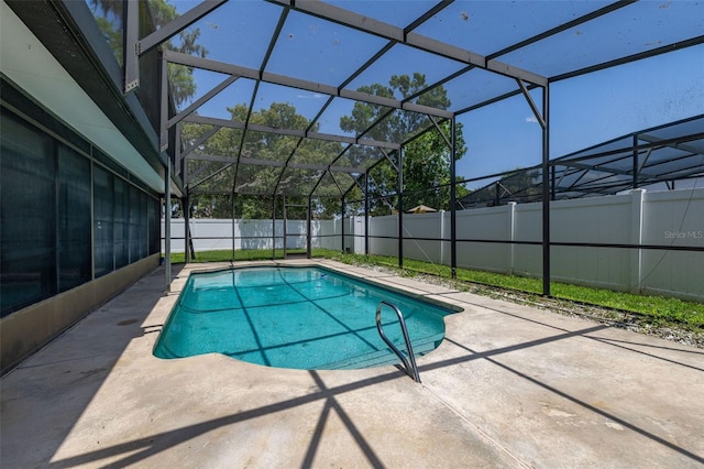 4307 Oak Ct, Saint Cloud, FL 34769 - view of swimming pool with a patio area, a fenced backyard, and glass enclosure