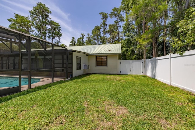 4307 Oak Ct, Saint Cloud, FL 34769 - rear view of property featuring an outdoor pool, metal roof, cooling unit, a gate, and a lanai