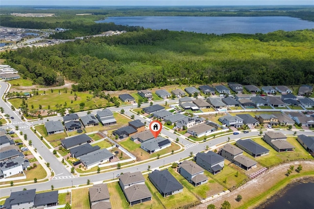 6651 Syreeta Ln, Harmony, FL 34773 - aerial view of property's location with a forest, a nearby body of water, and nearby suburban area