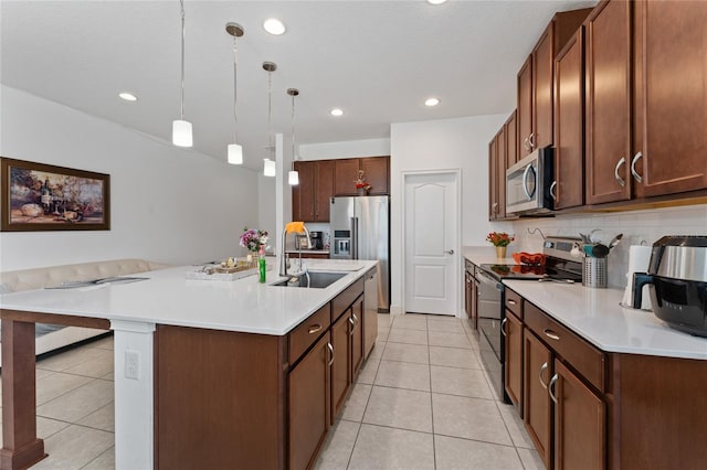 6651 Syreeta Ln, Harmony, FL 34773 - kitchen featuring stainless steel appliances, a sink, light tile patterned floors, light countertops, and recessed lighting