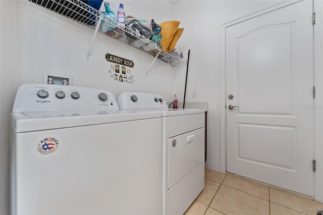 6651 Syreeta Ln, Harmony, FL 34773 - laundry area featuring washer and dryer and light tile patterned flooring