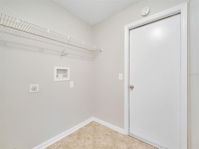 3274 Hunters Chase Loop, Kissimmee, FL 34743 - laundry room with washer hookup, hookup for an electric dryer, baseboards, and light tile patterned floors