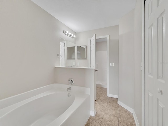 3274 Hunters Chase Loop, Kissimmee, FL 34743 - full bathroom featuring a garden tub, a closet, and tile patterned flooring