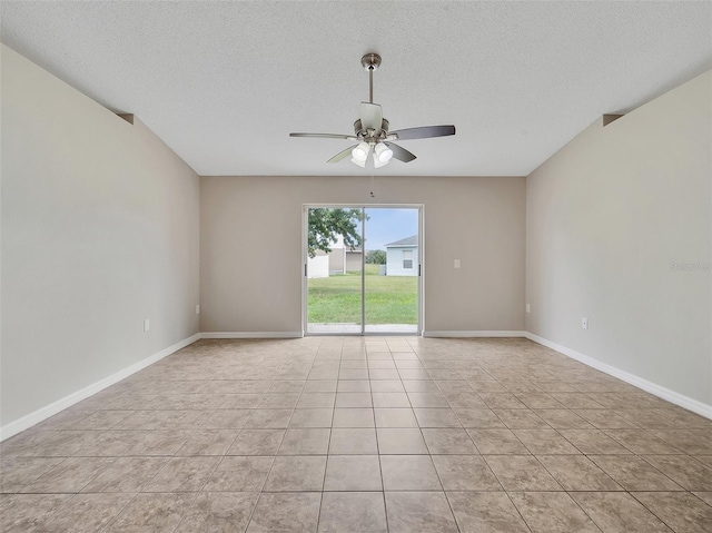 3274 Hunters Chase Loop, Kissimmee, FL 34743 - spare room with a ceiling fan, a textured ceiling, light tile patterned floors, and baseboards