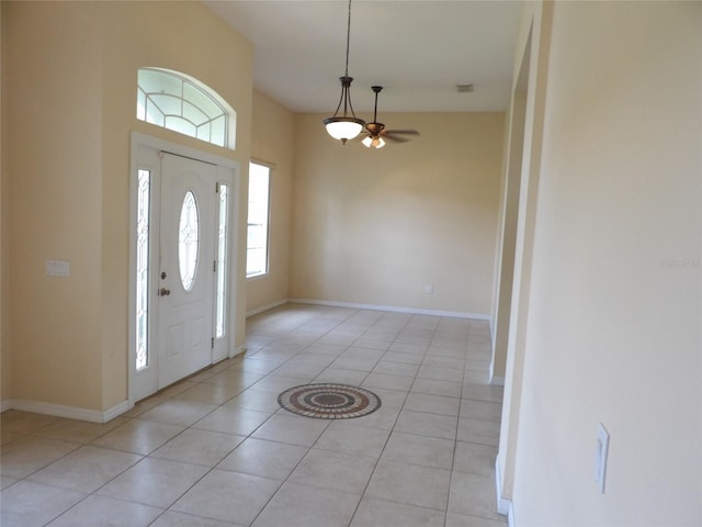 3074 Bay Laurel Cir N, Kissimmee, FL 34744 - entrance foyer featuring light tile patterned flooring, baseboards, and a ceiling fan