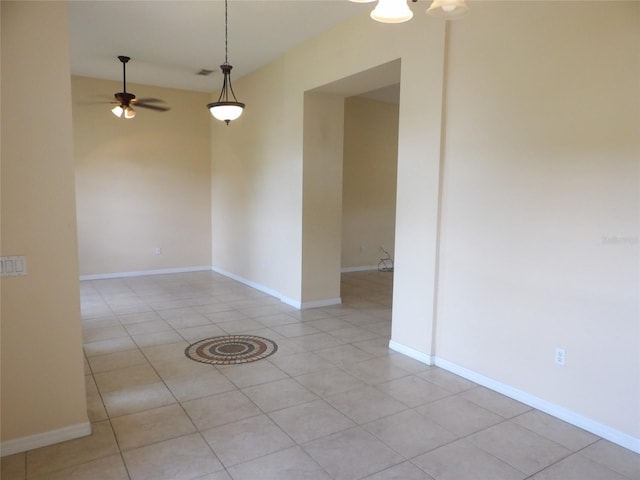 3074 Bay Laurel Cir N, Kissimmee, FL 34744 - spare room featuring ceiling fan, light tile patterned floors, and baseboards