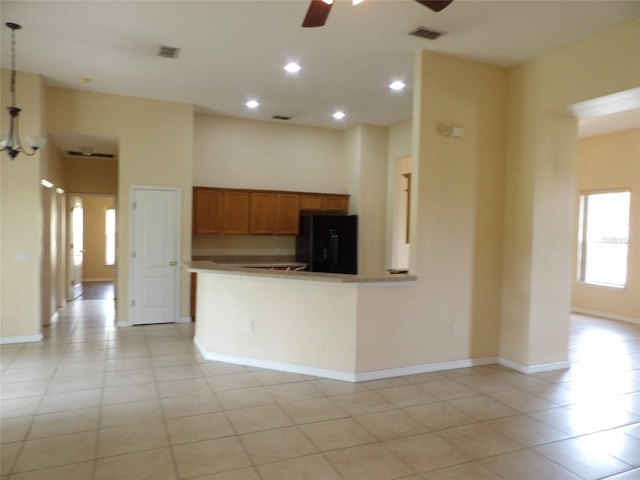 3074 Bay Laurel Cir N, Kissimmee, FL 34744 - kitchen with freestanding refrigerator, ceiling fan, light tile patterned flooring, recessed lighting, and baseboards