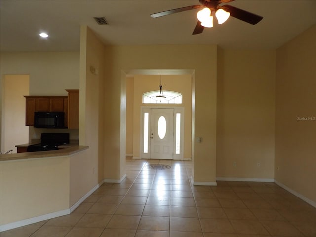 3074 Bay Laurel Cir N, Kissimmee, FL 34744 - foyer with ceiling fan, light tile patterned floors, recessed lighting, and baseboards