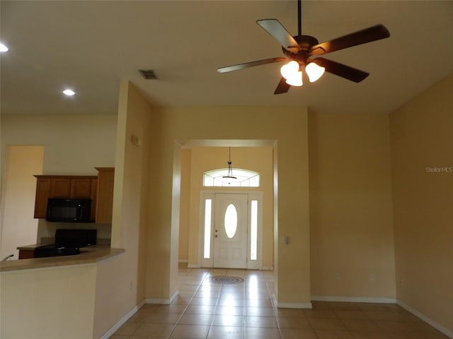 3074 Bay Laurel Cir N, Kissimmee, FL 34744 - foyer entrance with light tile patterned floors, recessed lighting, a ceiling fan, and baseboards