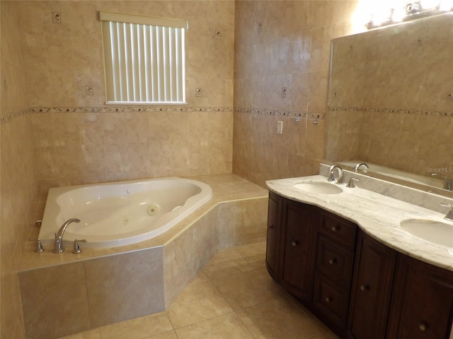 3074 Bay Laurel Cir N, Kissimmee, FL 34744 - full bath with tile walls, tile patterned flooring, a whirlpool tub, and double vanity