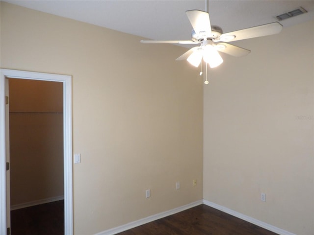 3074 Bay Laurel Cir N, Kissimmee, FL 34744 - empty room featuring ceiling fan, dark wood finished floors, and baseboards