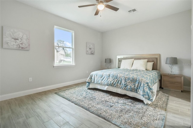 515 Everest Way, Kissimmee, FL 34758 - bedroom with wood finished floors, baseboards, and a ceiling fan