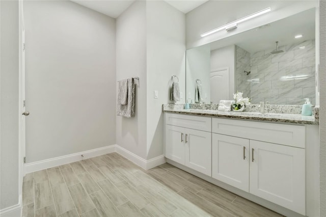515 Everest Way, Kissimmee, FL 34758 - full bath with double vanity, a stall shower, baseboards, and wood tiled floors