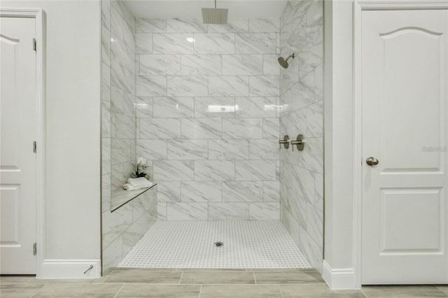 515 Everest Way, Kissimmee, FL 34758 - full bathroom with baseboards and a tile shower