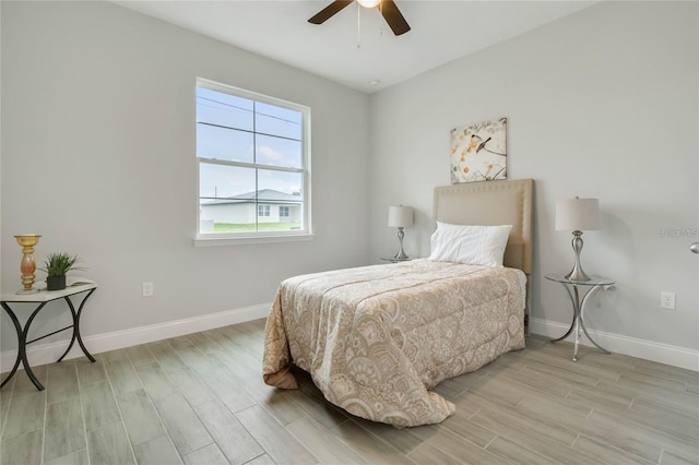 515 Everest Way, Kissimmee, FL 34758 - bedroom with light wood finished floors, baseboards, and ceiling fan