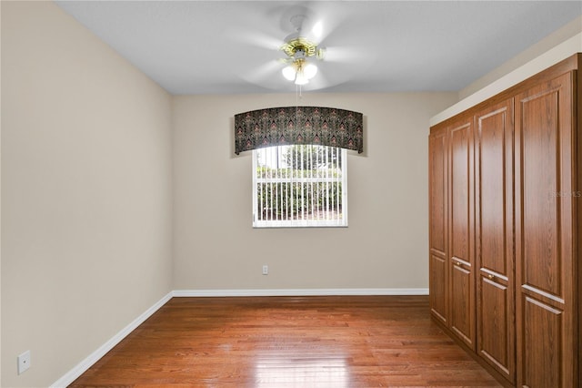4065 Kingsley St, Clermont, FL 34711 - unfurnished bedroom with wood finished floors and a ceiling fan