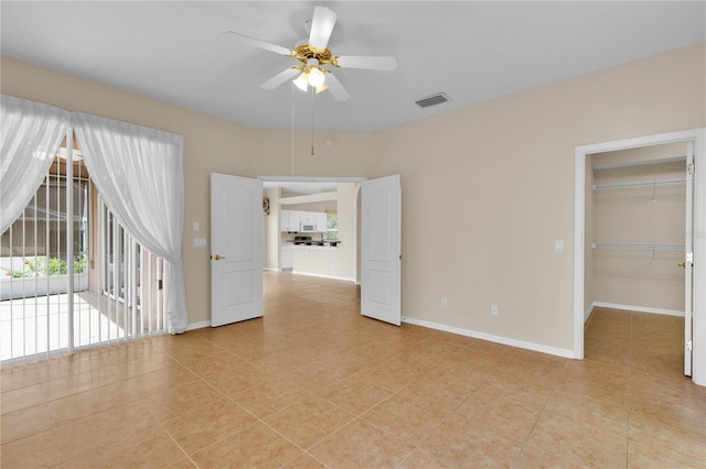4065 Kingsley St, Clermont, FL 34711 - empty room with light tile patterned flooring and ceiling fan
