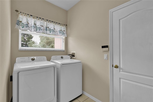 4065 Kingsley St, Clermont, FL 34711 - laundry room with washer and dryer and light tile patterned floors