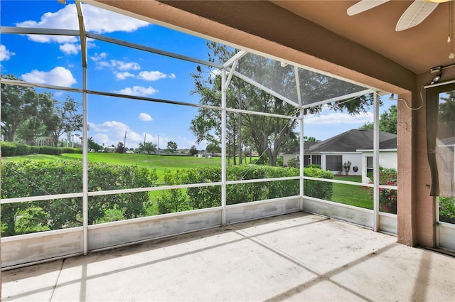 4065 Kingsley St, Clermont, FL 34711 - unfurnished sunroom with a ceiling fan and golf course view