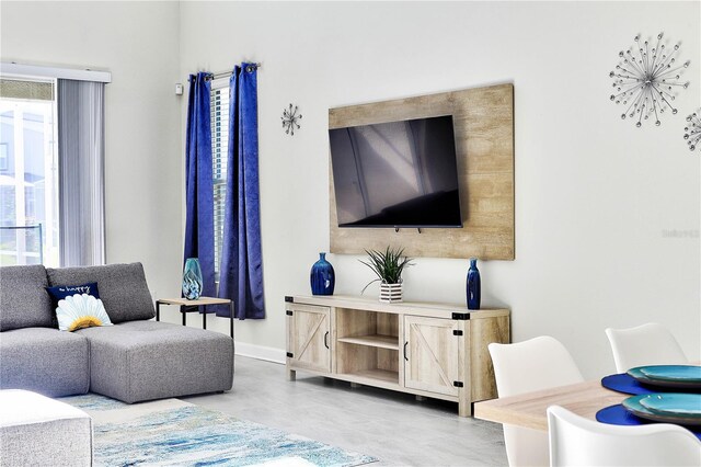 8974 Cabot Cliffs Dr, Davenport, FL 33896 - living room featuring baseboards