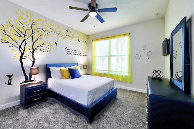 8974 Cabot Cliffs Dr, Davenport, FL 33896 - bedroom with dark carpet, baseboards, and a ceiling fan