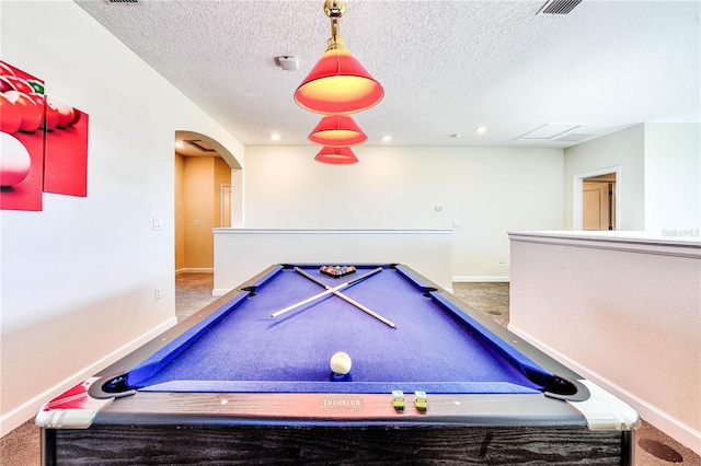 8974 Cabot Cliffs Dr, Davenport, FL 33896 - game room with baseboards, a textured ceiling, arched walkways, carpet, and pool table