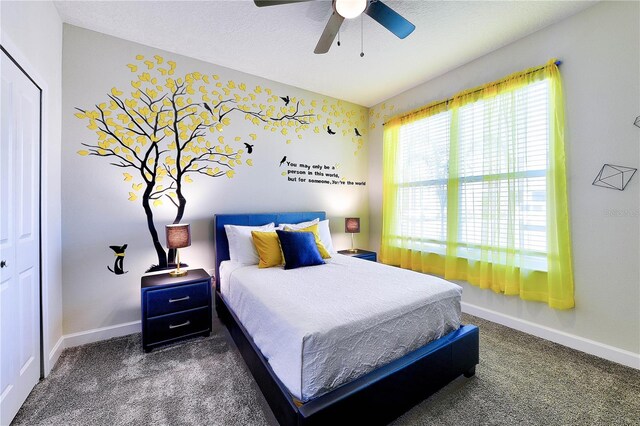 8974 Cabot Cliffs Dr, Davenport, FL 33896 - bedroom with carpet, baseboards, and a ceiling fan