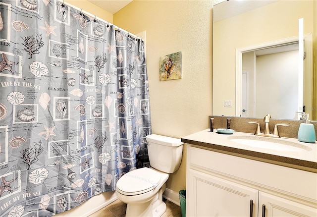 8974 Cabot Cliffs Dr, Davenport, FL 33896 - full bathroom with toilet, vanity, and tile patterned floors