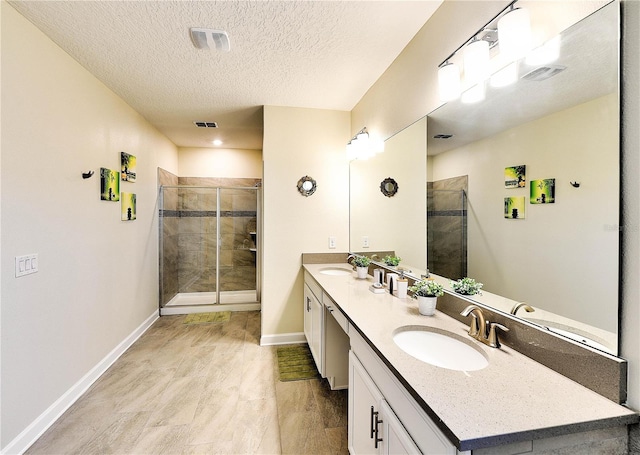8974 Cabot Cliffs Dr, Davenport, FL 33896 - full bath with baseboards, double vanity, a stall shower, and a textured ceiling