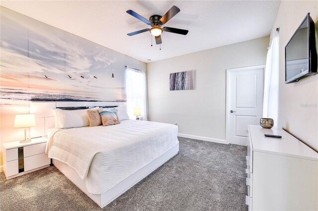 8974 Cabot Cliffs Dr, Davenport, FL 33896 - bedroom featuring carpet floors, baseboards, and ceiling fan