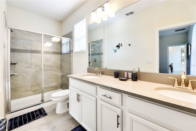 8974 Cabot Cliffs Dr, Davenport, FL 33896 - bathroom featuring toilet, a shower stall, and double vanity