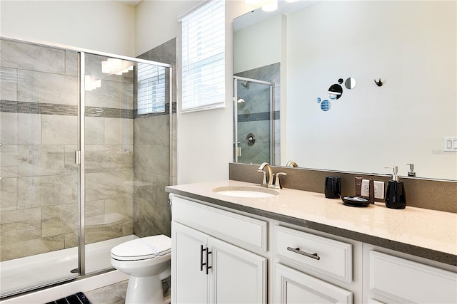8974 Cabot Cliffs Dr, Davenport, FL 33896 - bathroom with vanity, toilet, and a stall shower