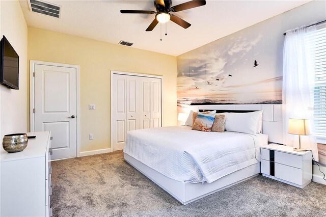 8974 Cabot Cliffs Dr, Davenport, FL 33896 - bedroom with carpet, a closet, ceiling fan, and baseboards
