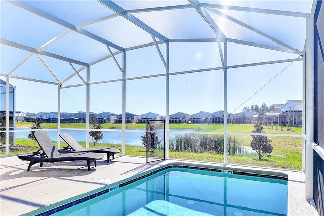 8974 Cabot Cliffs Dr, Davenport, FL 33896 - outdoor pool with a residential view, a patio, a lanai, and a water view