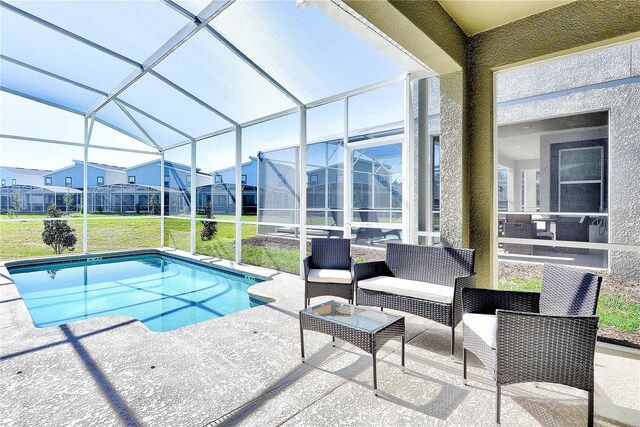 8974 Cabot Cliffs Dr, Davenport, FL 33896 - swimming pool featuring a patio area, a yard, glass enclosure, and an outdoor living space