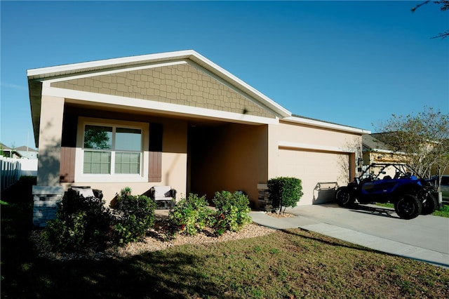 153 Taft Dr, Davenport, FL 33837 - view of front of house featuring a garage, stucco siding, and driveway