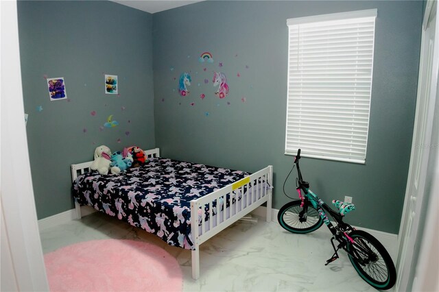 153 Taft Dr, Davenport, FL 33837 - bedroom featuring marble look tiles and baseboards