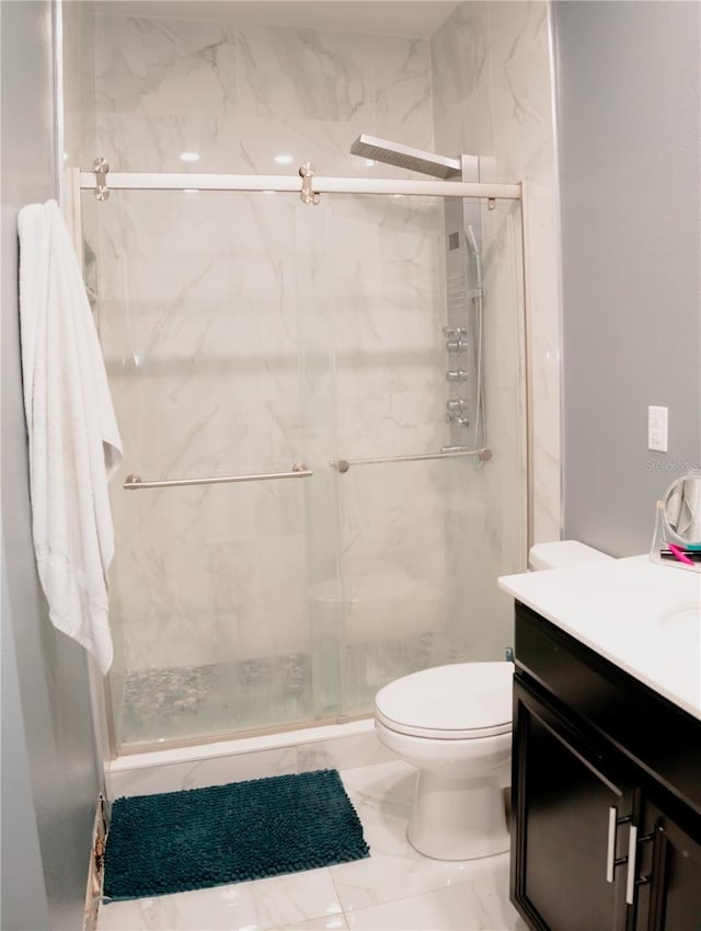153 Taft Dr, Davenport, FL 33837 - full bath featuring vanity, toilet, a marble finish shower, and marble finish floors