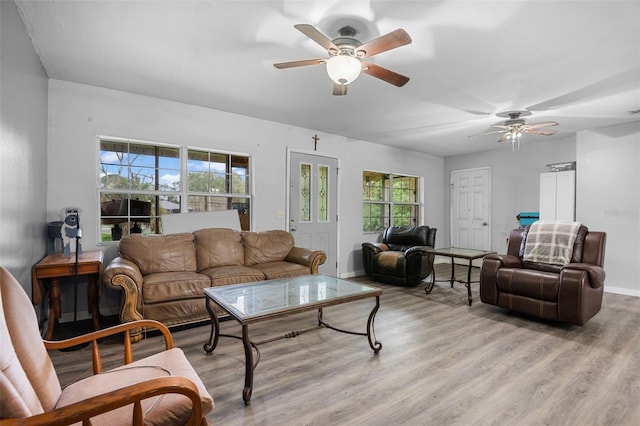 5381 Avocado Ave, Cocoa, FL 32926 - living area with light wood-style floors, ceiling fan, and plenty of natural light