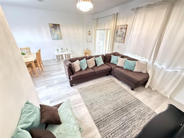 615 Terra Lago St, Davenport, FL 33897 - living area featuring wood finished floors and a chandelier