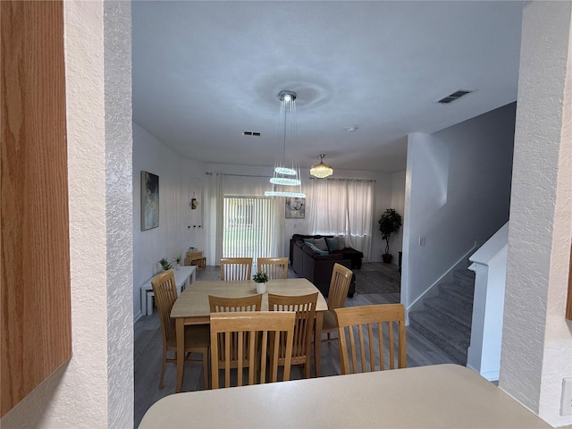 615 Terra Lago St, Davenport, FL 33897 - dining room featuring a textured wall and wood finished floors