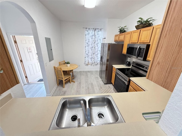 615 Terra Lago St, Davenport, FL 33897 - kitchen featuring stainless steel appliances, arched walkways, light countertops, and electric panel